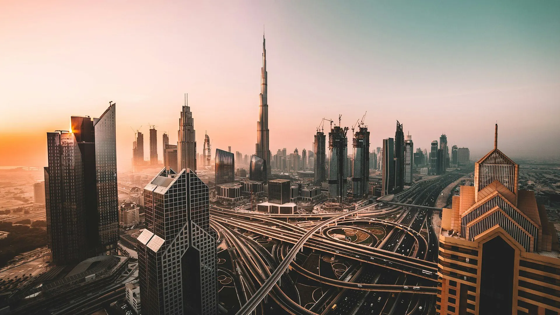 Dubai skyline at sunset with high-rise towers served by UAE MEP contractors