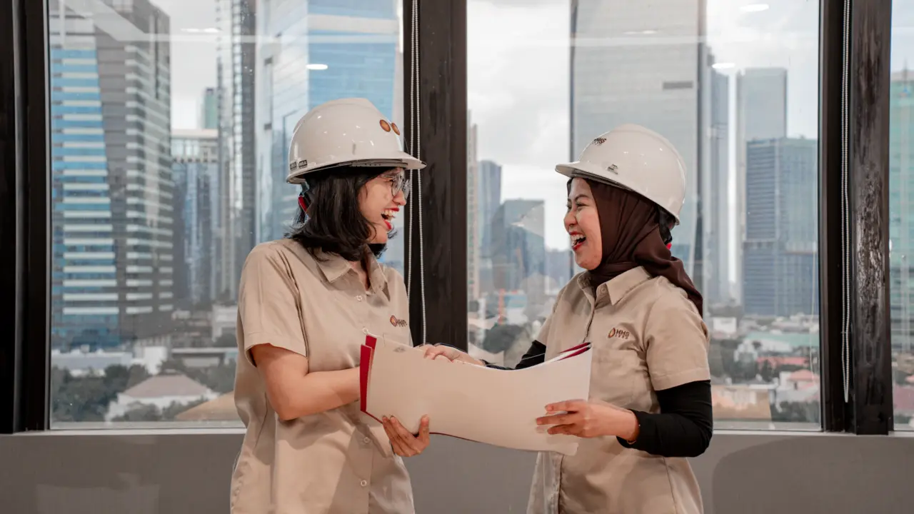 Engineers coordinating MEP drawings before work starts
