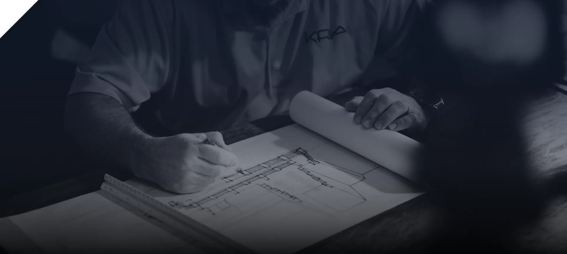 Engineer drawing on construction blueprints