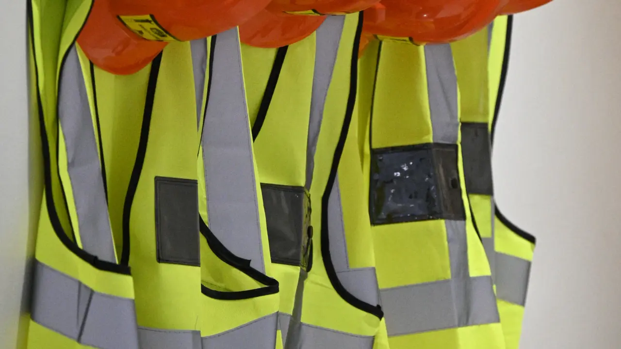 Hard hats and high-visibility vests for site safety
