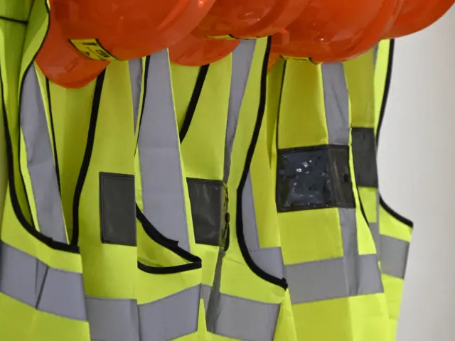 Hard hats and high-visibility vests for site safety